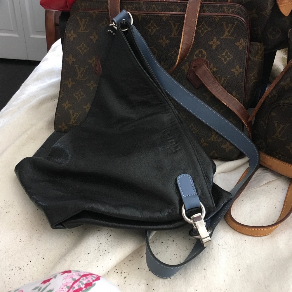 a Cleo $ Palek  asymmetrical leather backpack